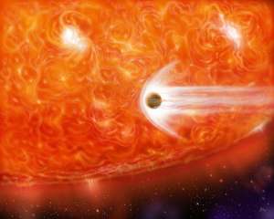Artist’s impression of a red supergiant engulfing a Jupiter-like planet as it expands