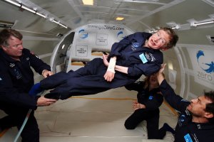 Physicist Stephen Hawking (center) enjoys zero gravity during a flight aboard a modified Boeing 727.