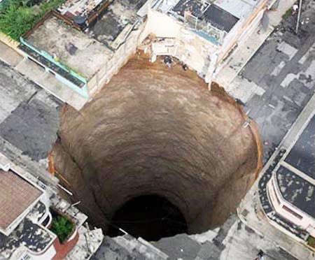 This sinkhole appeared in downtown Guatemala City, swallowing a three-story building. via Moises Castillo