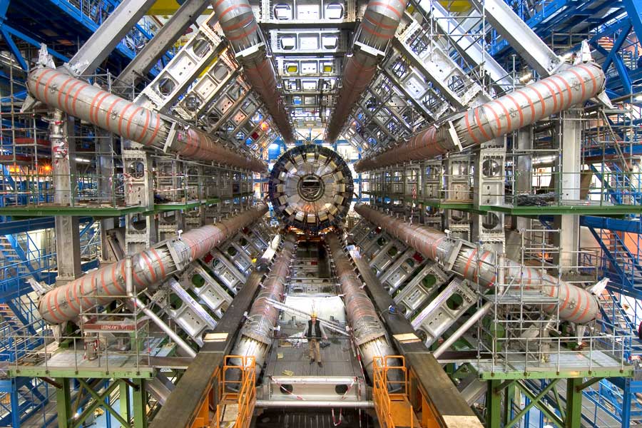 The Higgs Boson was discovered at The Large Hadron Collider. For perspective on its size, see the person standing in the middle of the machine. (Credit: Maximilien Brice, CERN) (Source)