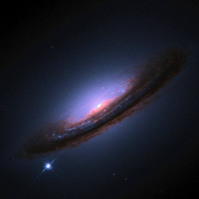 Type 1a supernova depicted here at the lower left hand corner. Image credit: High-Z Supernova Search Team, HST, NASA