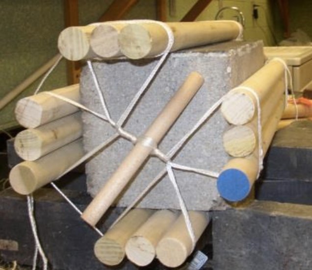 The concrete block with the 12 rods attached. A second variation, with smaller diameter rods placed in the two intersection of the three larger rods also proved stable, and was successful in reducing the peak force required to start the rolling motion of the block | Image and caption credit: West, Gallagher and Waters