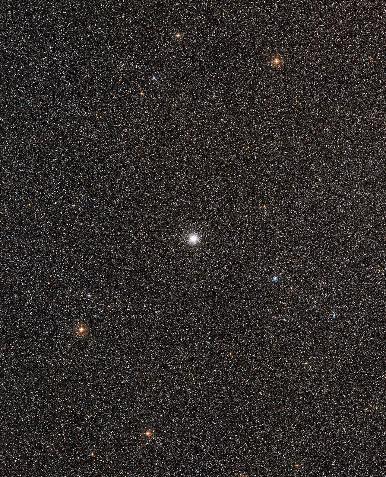 This visible-light wide-field image of the region around the globular star cluster Messier 54 was created from photographs forming part of the Digitized Sky Survey 2. The globular star cluster Messier 54 cluster appears at the centre. Credit: ESO and Digitized Sky Survey 2