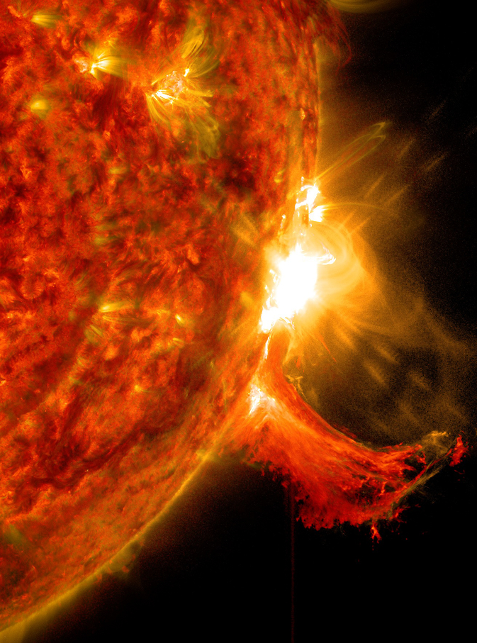Description: "NASA's Solar Dynamics Observatory captured this image of a solar flare on Oct. 2, 2014. The solar flare is the bright flash of light on the right limb of the sun. A burst of solar material erupting out into space can be seen just below it." (Credit: NASA/SDO)