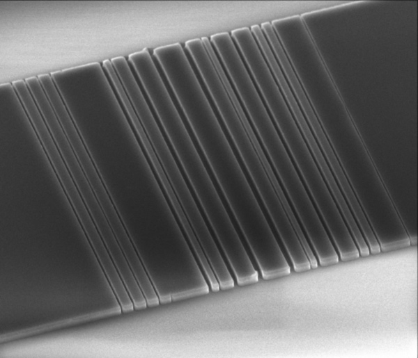 This tiny slice of silicon, etched in Jelena Vuckovic's lab at Stanford with a pattern that resembles a bar code, is one step on the way toward linking computer components with light instead of wires.