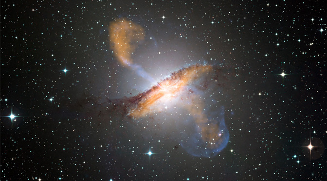 Color composite image of Centaurus A, revealing the lobes and jets emanating from the active galaxy’s central black hole.Image credit: ESO/WFI
