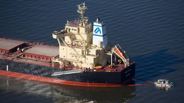 Conventional oil booms such as those deployed around this leaking vessel in Vancouver may become a thing of the past. - (Photo by Darryl Dyck courtesy of the Canadian Press)