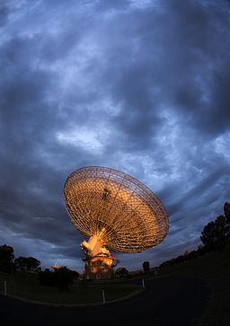 The Parkes Observatory radio telescope in New South Wales, Australia. Photo courtesy of CSIRO via Wikimedia Commons.