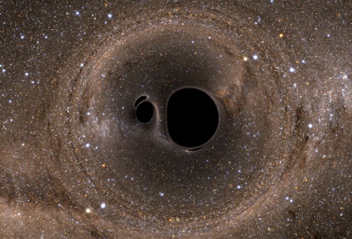  A pair of black holes that are about to merge, with the Milky Way visible in the background. Image credit: Andy Bohn