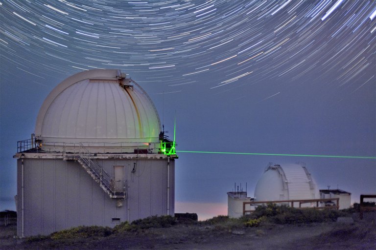 Long-Distance Teleportation and Quantum Entanglement Achieved With Twisted Photons