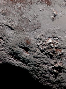 High resolution color image of Wright Mons, a potential cryovolcano on Pluto. Credit: NASA