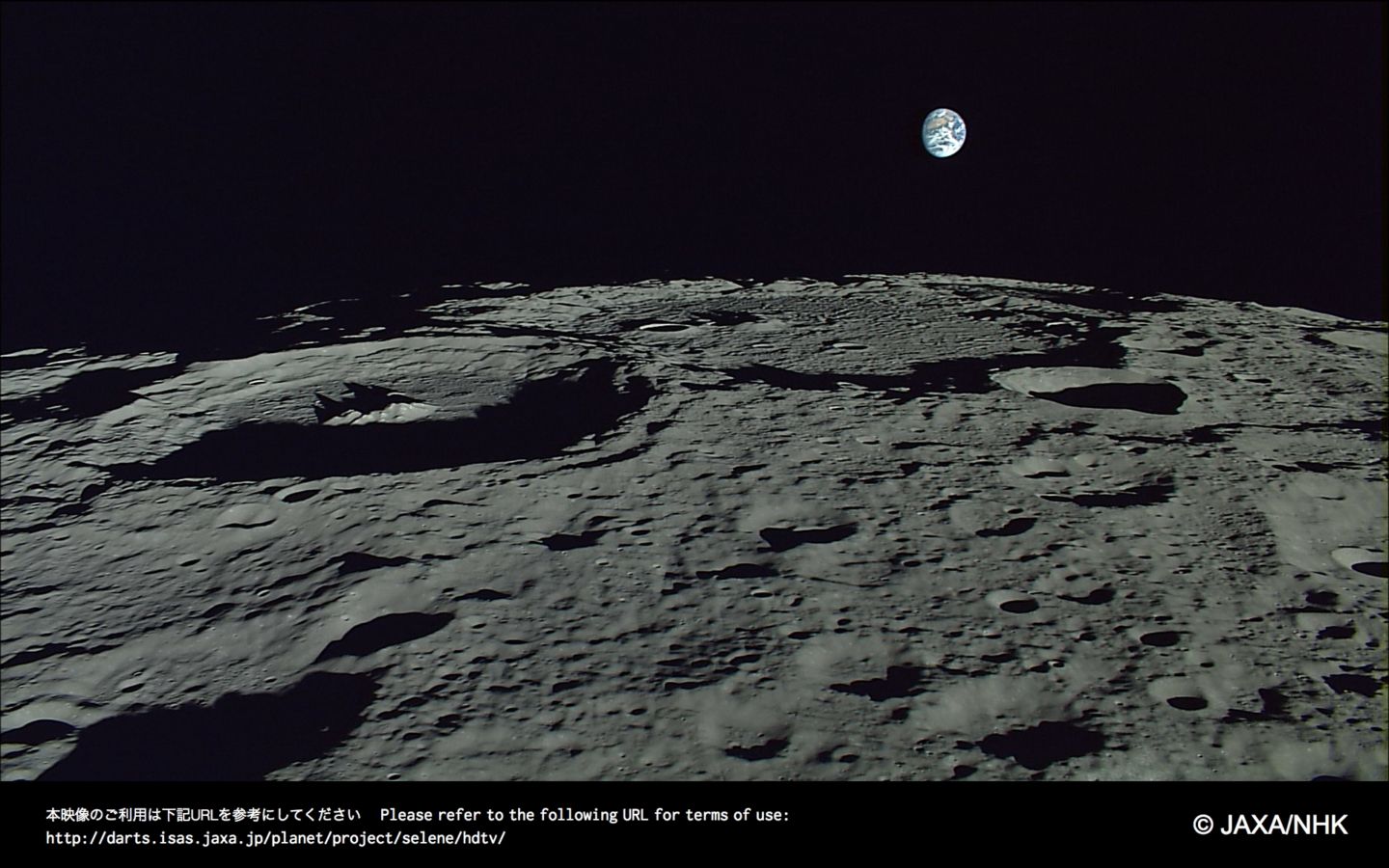 Earth rising in the distance. Credits: JAXA