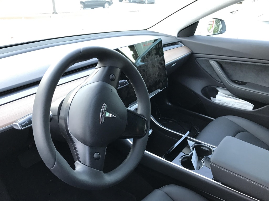 The Model 3's dashboard and steering wheel. Image Credit: You You Xue @youyouxue