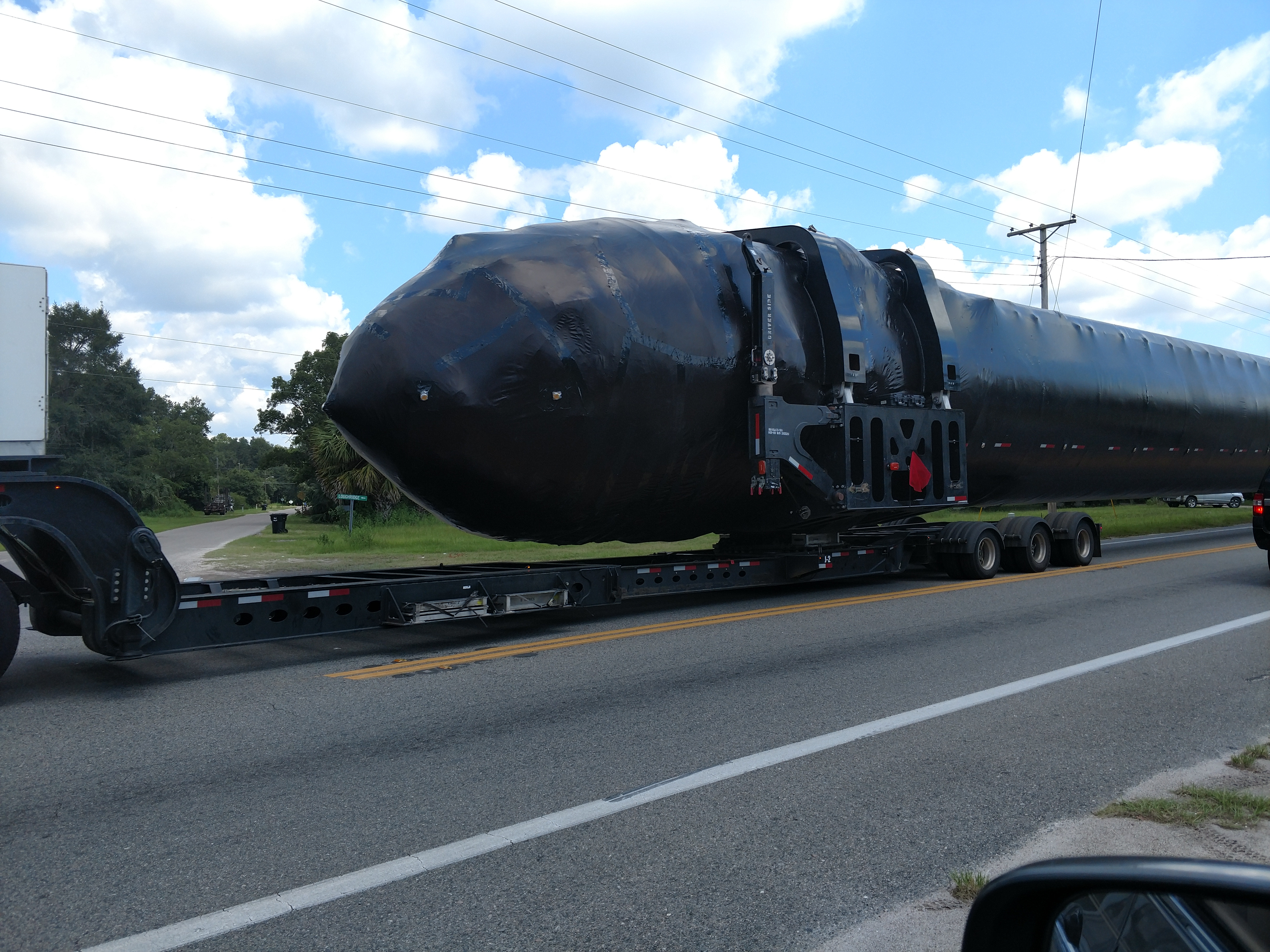 Another shot of the Falcon booster en route to McGregor, Texas. (Image Credit: Imgur user RobertBass)