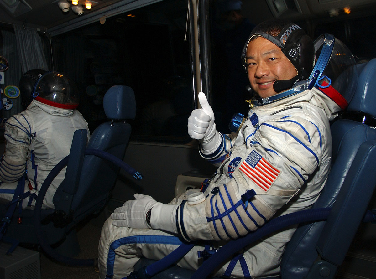 Leroy Chiao flashes a thumbs-up on the way to launch. Chiao says earth to earth flights may not be for the faint of heart.