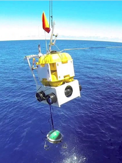 An Ocean-Bottom Seismometer being dropped into the sea, where it measured Earth's hum from the ocean floor. Image credit: RHUM-RUM experiment/Meteor Cruise