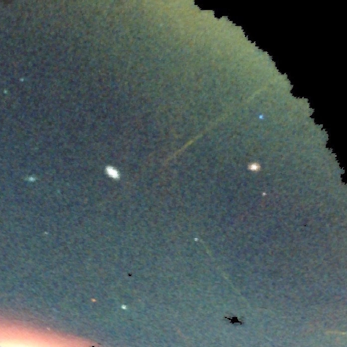 A portion of the sky mapped by the DES. Stellar streams are blue, yellow, and red ribbons. Image Credit: Dark Energy Survey