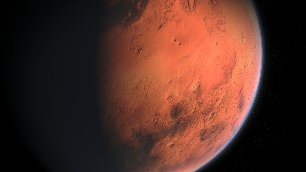 A hazy half-eclipsed image of Mars. Mars bacteria could have evolved to be similar to those found in Earth's driest deserts.
