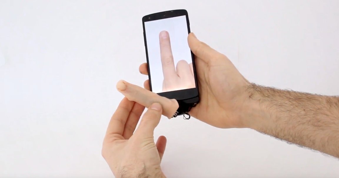 This robotic finger attaches to a smartphone or tablet, allowing the device to crawl itself across a table or stroke the back of a user's hand.
