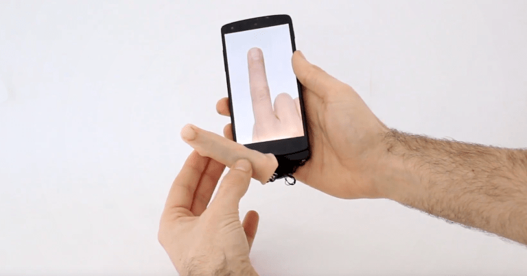 This robotic finger attaches to a smartphone or tablet, allowing the device to crawl itself across a table or stroke the back of a user's hand.