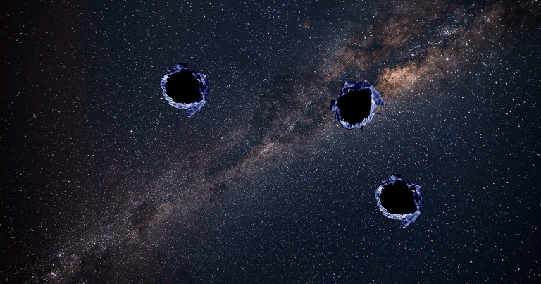 Something punched gigantic holes through the Milky Way. There's little evidence at the cosmic crime scene, but scientists suspect it was dark matter.