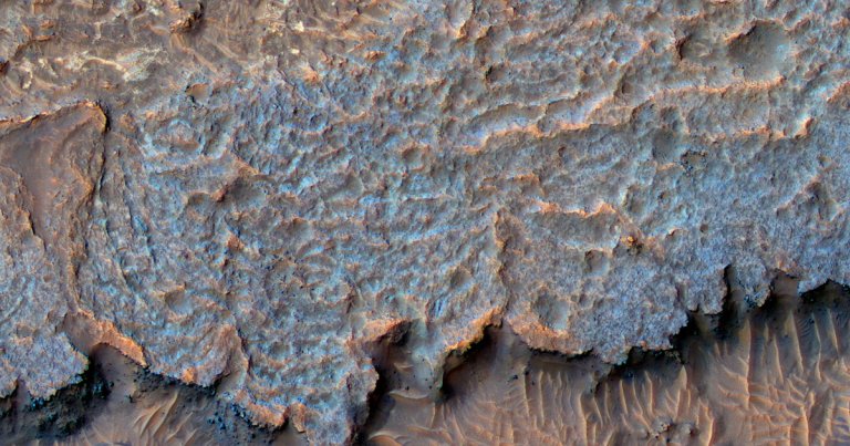 Scientists have no idea what formed a series of bizarre ridges on the surface of Mars, and they're not confident in their guess.