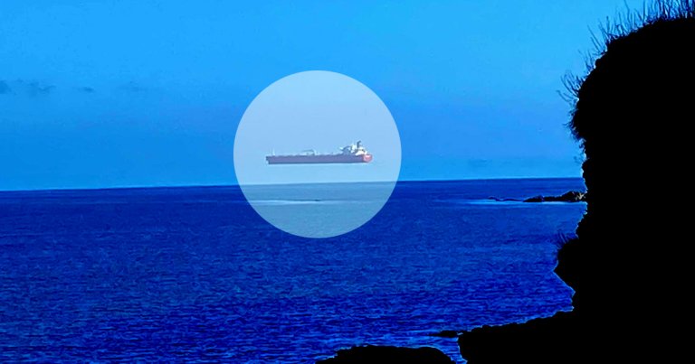 A bizarre photograph of a ship seemingly hovering above the sea off the coast of Cornwall, UK, made its rounds late Thursday.