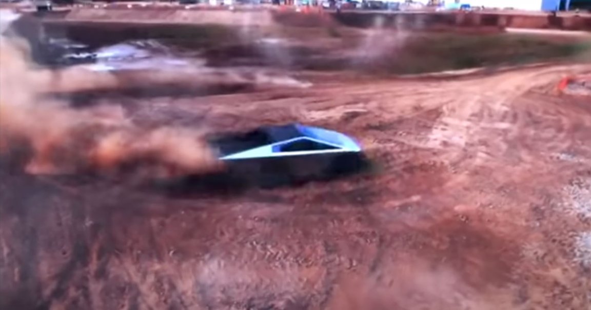 A newly leaked showroom video shows a Tesla Cybertruck with rear wheel steering and rear view mirrors tear it up on some dirt roads.