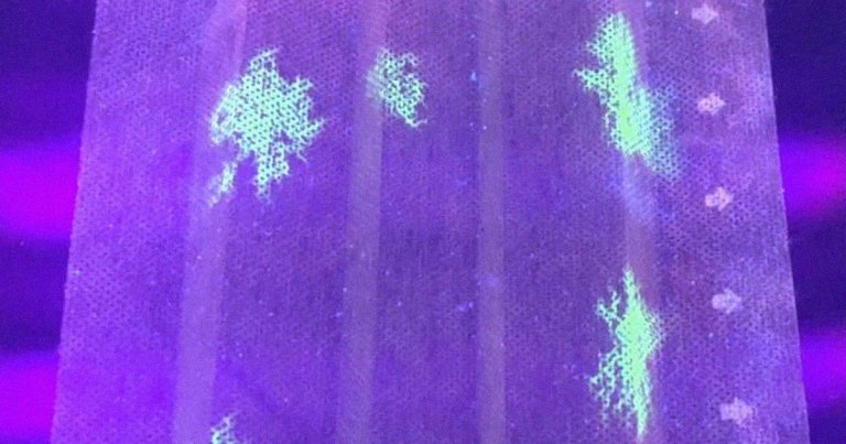 A team of researchers in Kyoto, Japan have created a mask that glows under a UV light when exposed to the coronavirus.