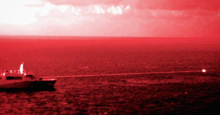 The US Navy has fired a laser weapon at a floating target in the Mideast, destroying it, the Associated Press reports.