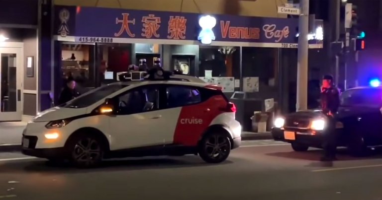 A viral video of police officers pulling over a self-driving taxi is as dystopian as it is hilarious.