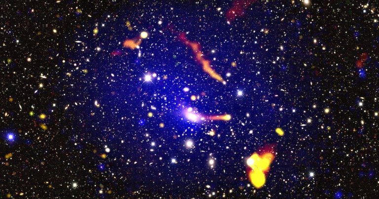 New photos of a far-flung galaxy cluster have left a group of scientists stumped as they ponder whether they've discovered a new form of physics. 