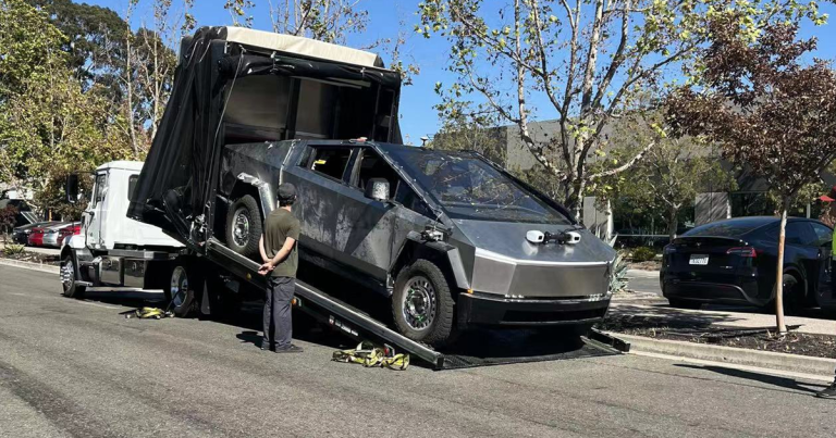 Onlookers have spotted an extremely beat up Tesla Cybertruck — which has yet to make its public debut — being towed on a public street.