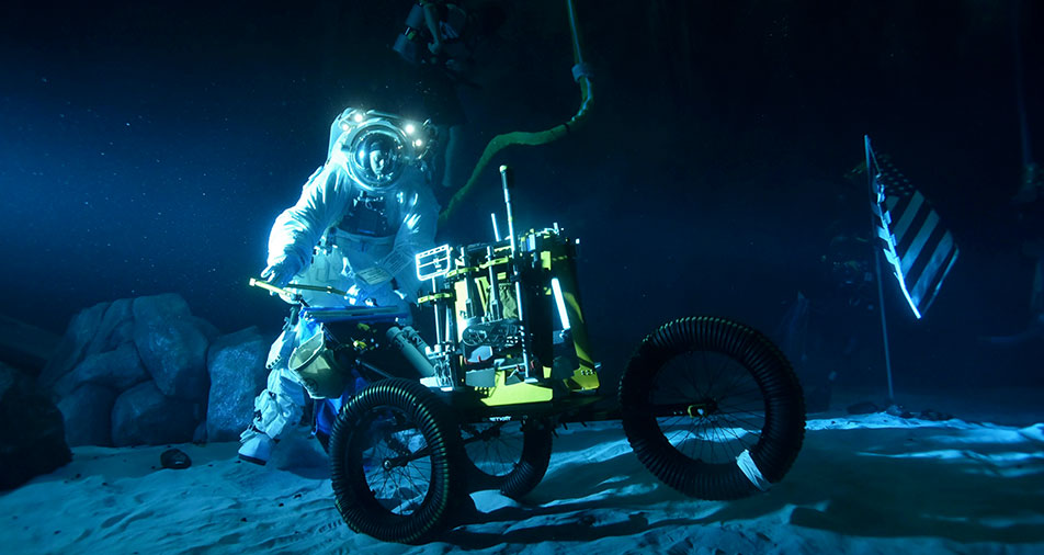 NASA has turned its giant 6.2 million-gallon Neutral Buoyancy Laboratory (NBL) into a replica of the surface of the Moon to train astronauts.
