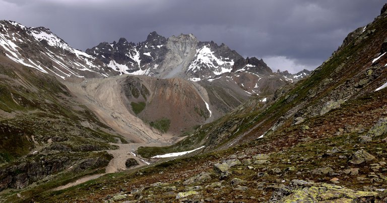 A part of the summit of a mountain in the Alps has collapsed, the likely result of permafrost thawing, dramatic footage shows.
