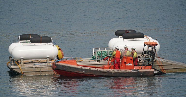 Officials have pulled the wreck of OceanGate's imploded submersible and possibly the remains of its crew of five passengers from the ocean.