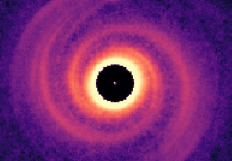 A new look at a protoplanetary disk surrounding a star revealed a massive exoplanet forming spiral arms, the first detection of its kind,