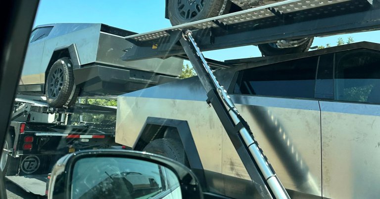 A recent image shows three Tesla Cybertrucks on the back of a car carrier trailer covered in smudges and stains.