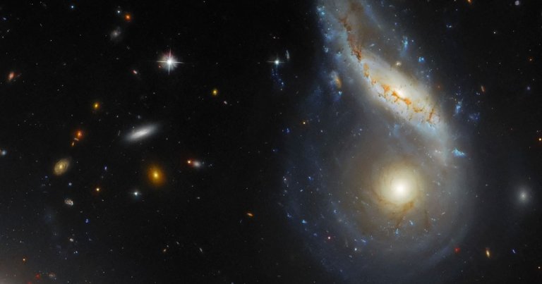 NASA's Hubble Space Telescope has snapped a glorious image of two massive galaxies in the process of colliding with each other.