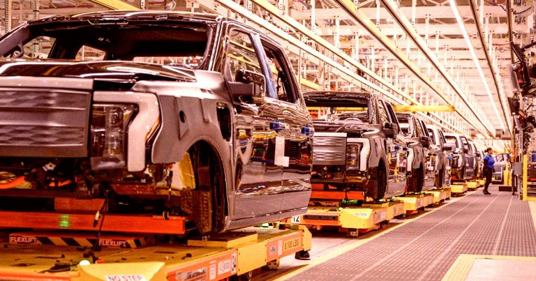 After racing to meet surging demand for electric cars just six months ago, carmakers are now slamming the brakes, and cutting output.