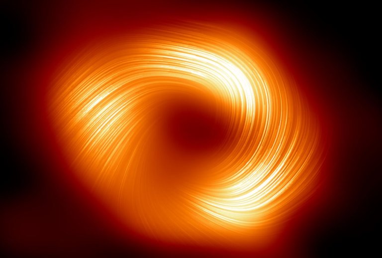 Astronomers captured the black hole at the center of the Milky Way in polarized light and its surrounding magnetic fields for the first time.