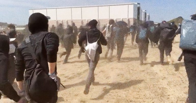 Masked protesters broke down a fence and tried to breach a Tesla factory building in Germany in order to stop expansion plans.
