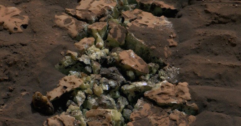 NASA's Curiosity Mars rover crushed a rock while exploring — and revealed a treasure of glinting, yellow crystals.