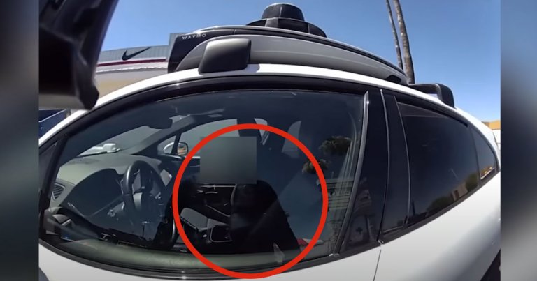 A video shows a police officer in Phoenix, Arizona pulling over a self-driving vehicle after it drove down a busy road in the opposing lane.