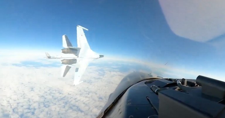 Video footage shows the moment when a Russian fighter jet flew screamingly close to an F-16 in the skies above Alaska last month.