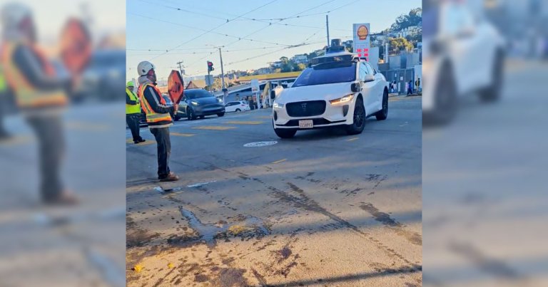 A new video shows a driverless Waymo robotaxi struggling to decipher the hand signals of a construction worker.