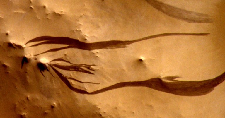 Planetary scientists concluded that dark streaks spotted on the surface of Mars didn't have anything to do with flowing water.