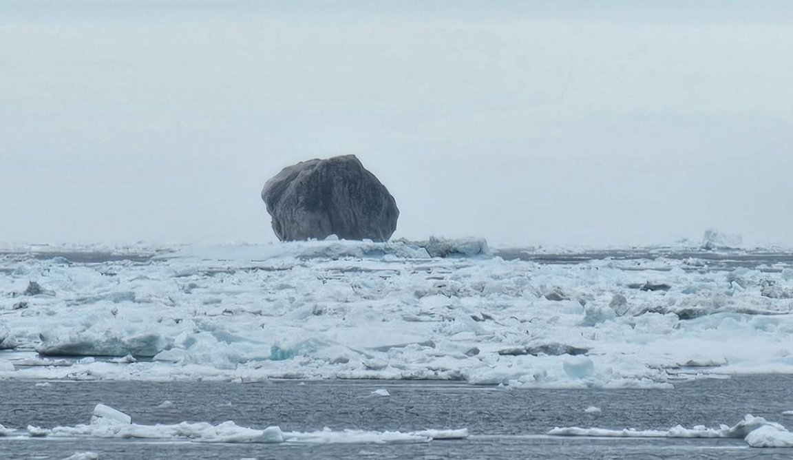 There's a huge black iceberg floating off the frigid coast of Northeastern Canada — and a photo of the strange structure has gone viral.