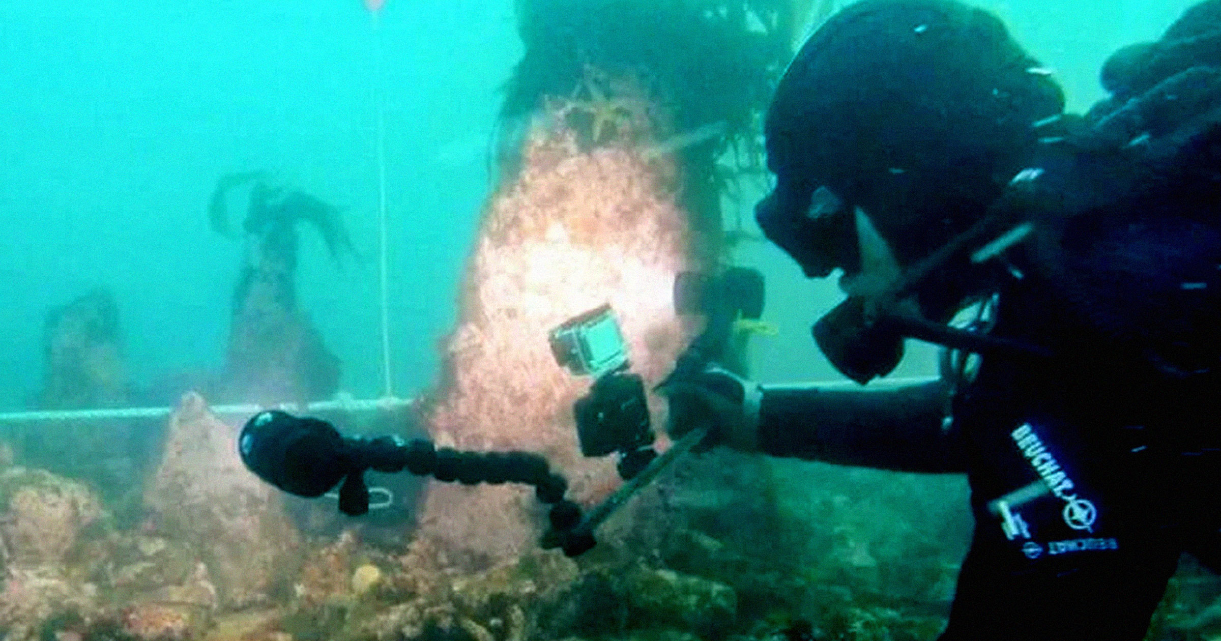 Divers Intrigued by Huge Underwater Structure