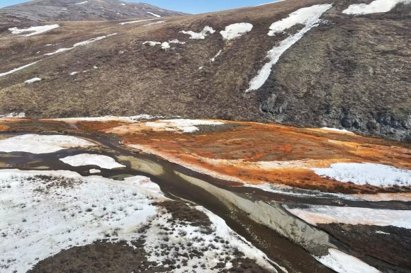 Some of Alaska's scenic rivers and streams look downright apocalyptic this year because they turned a flagrant orange color.